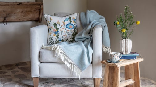 A floral cushion and throw - part of the spring collection 2025